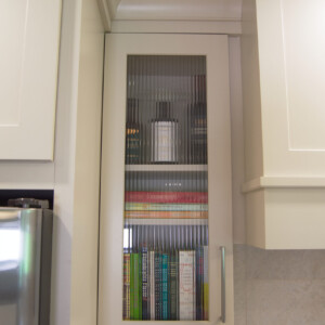 Durasupreme Glass Paneled Cabinetry Door and Custom Range Hood Framing