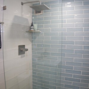 Wall Tile: Collossae Beige & Ape Green Floor Tile: Mosaic Green Pebble with Rainshower Faucet