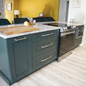 Bottle Green Ultra Craft island with trash/recycling and deep drawers
